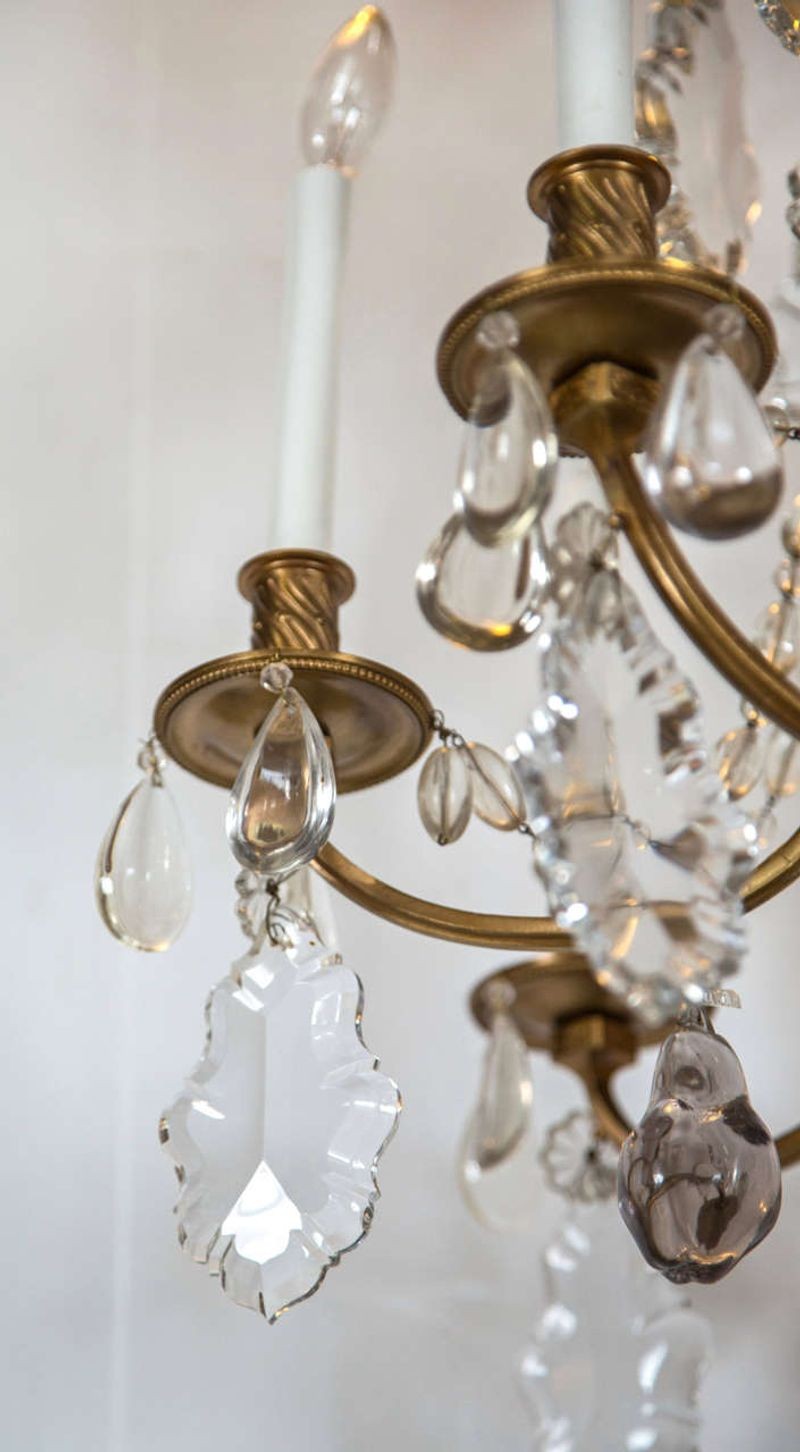 A Finely Cast Bronze and Crystal Eight Arm Chandelier