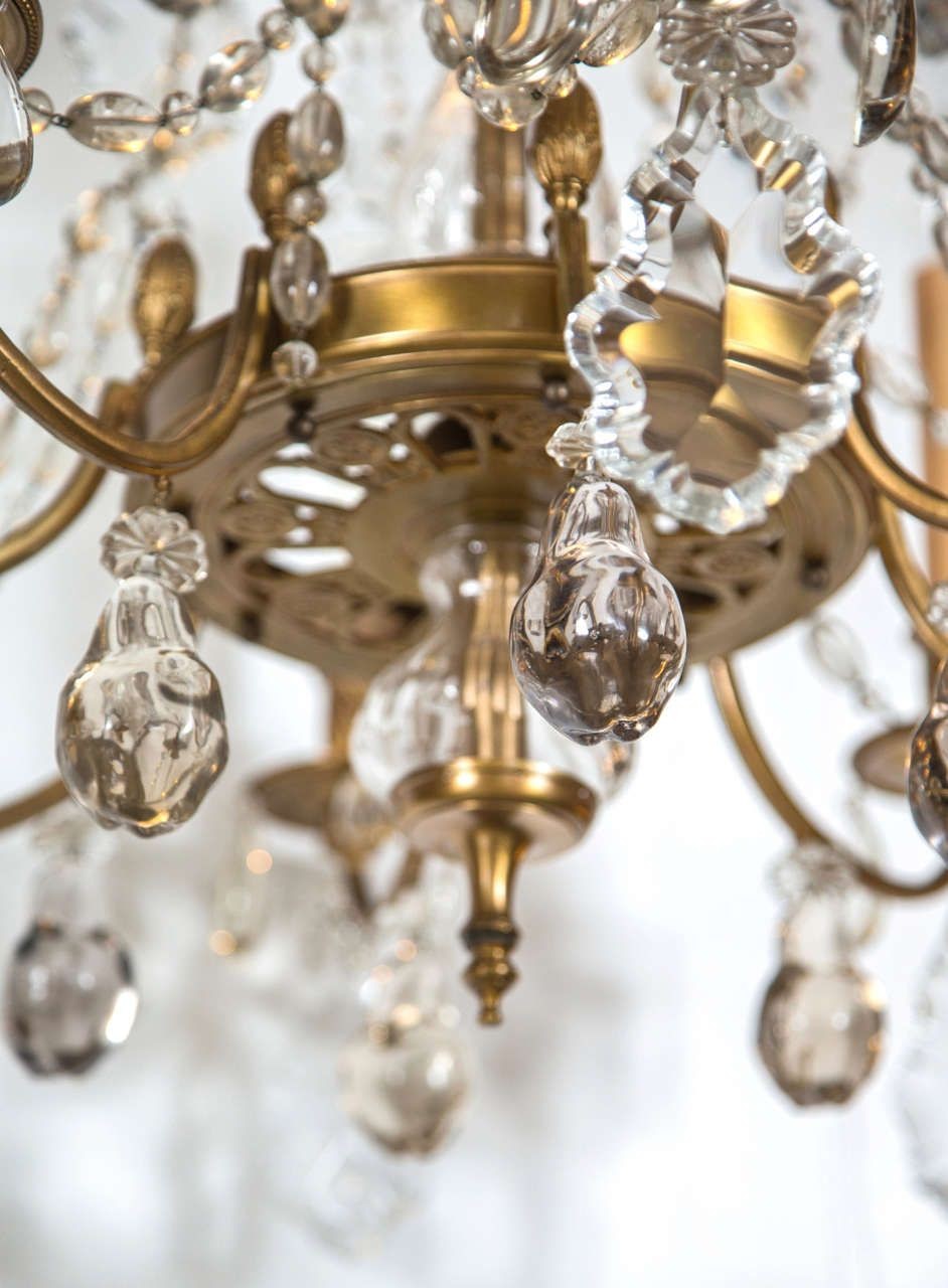 A Finely Cast Bronze and Crystal Eight Arm Chandelier